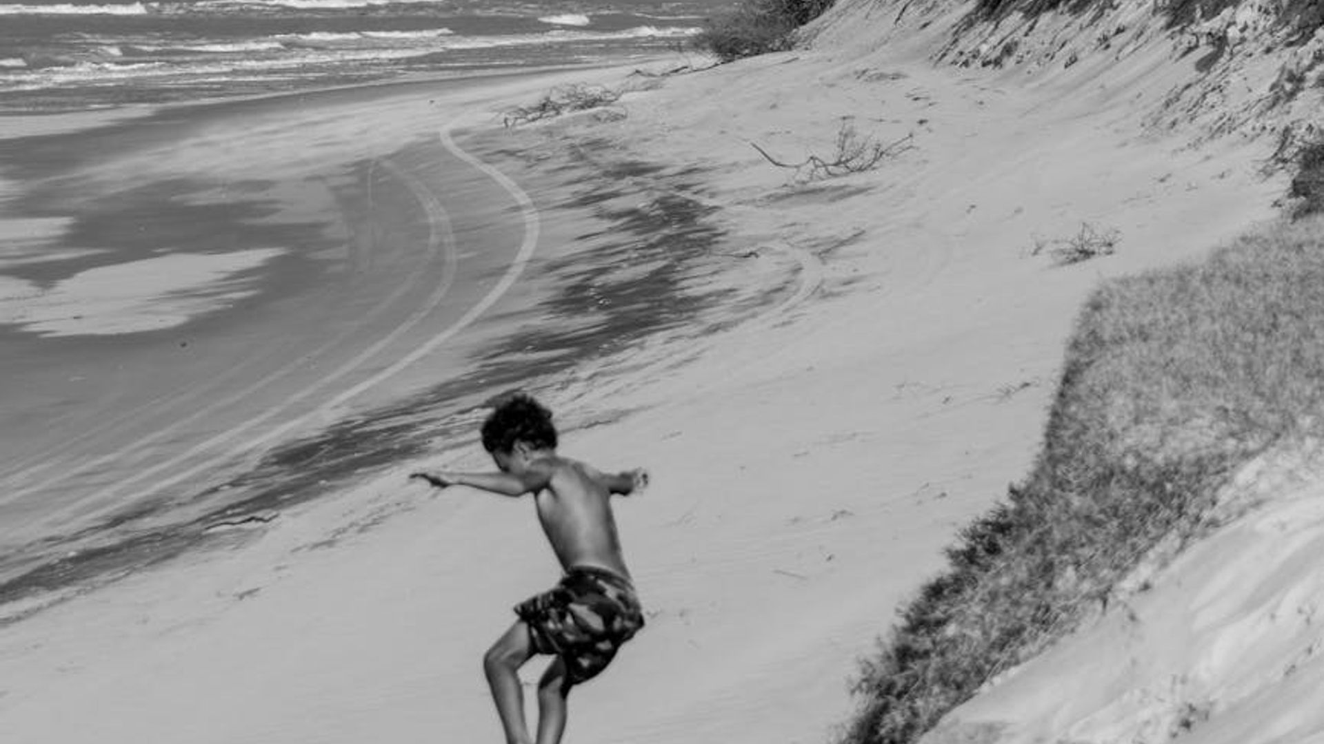 Person doing dynamic movements in a bright studio space